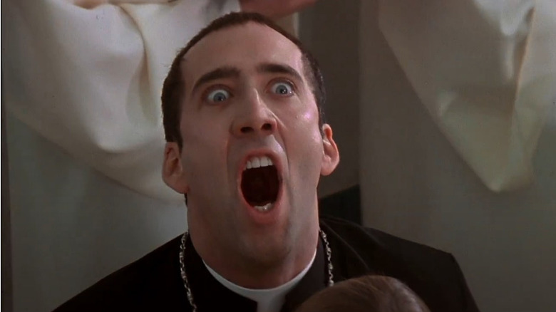 Nicolas Cage as Castor Troy singing with a choir in Face Off