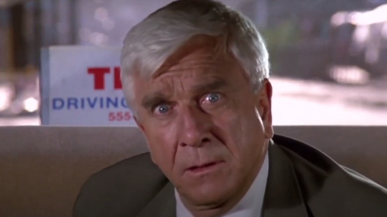 Leslie Nielson in backseat