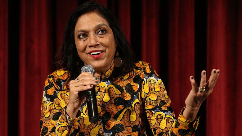Mira Nair smiling and gesticulating 