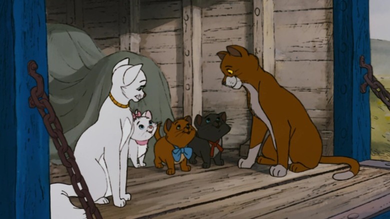 Duchess, Marie, Toulouse, Berlioz, and Thomas O'Malley sitting in a train wagon in The Aristocats