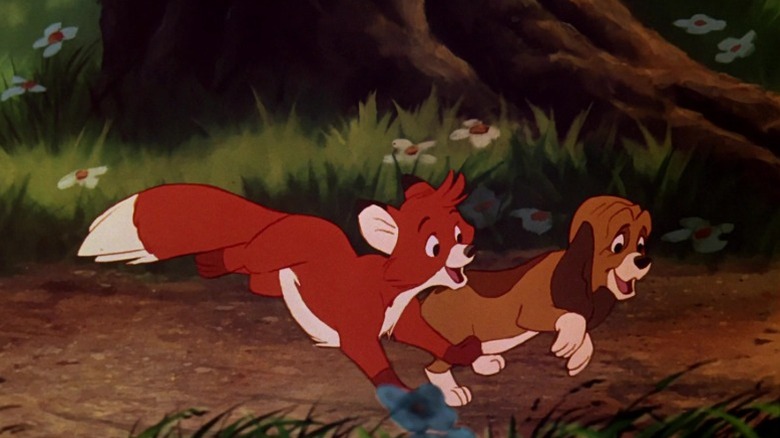 Tod and Copper running through the woods and smiling in The Fox and the Hound