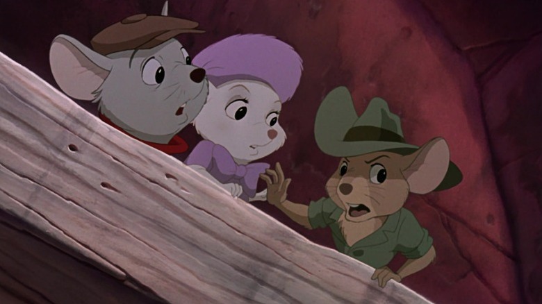 Bernard, Miss Bianca, and Jake looking over a wood plank in The Rescuers Down Under