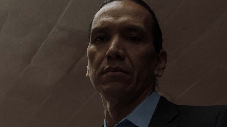Michael Greyeyes stares