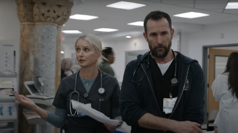 Katherine LaNasa's Dana Evans walks through the ER with Noah Wyle's Dr Michael Robinavitch in The Pitt