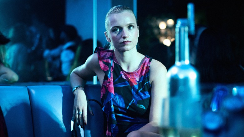 Tea blends into her surroundings for her mission in The Asset