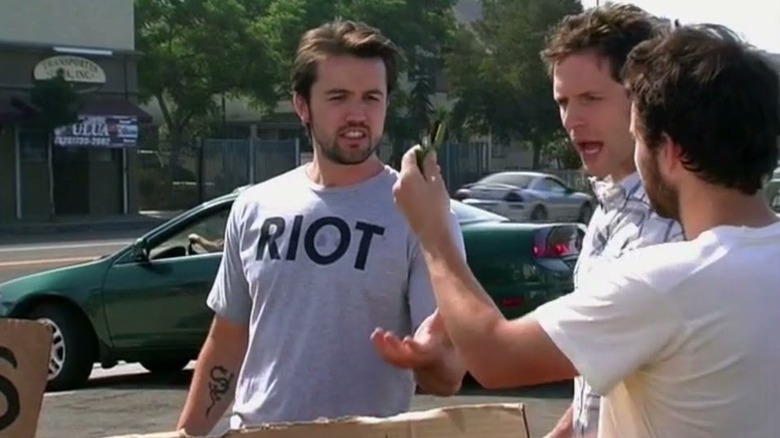Rob McElhenney, Glenn Howerton, and Charlie Day outside It's Always Sunny In Philadelphia