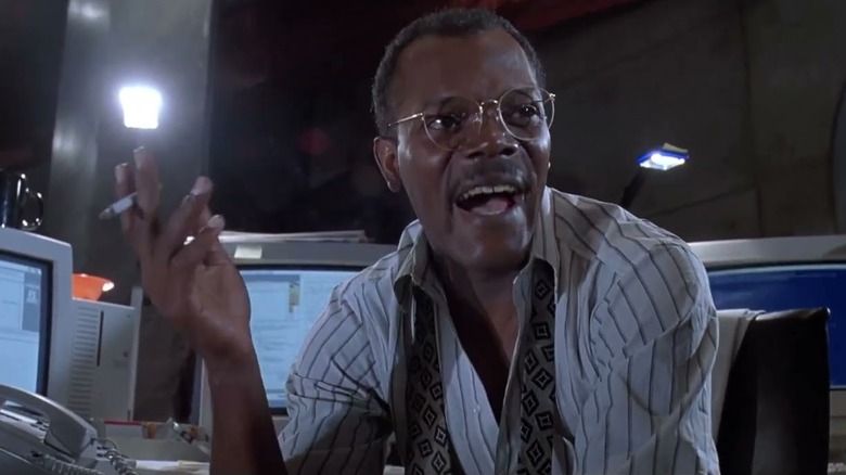 Samuel L Jackson talking, cigarette in hand