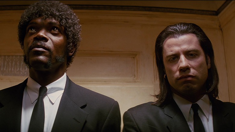Samuel L. Jackson and John Travolta standing in elevator