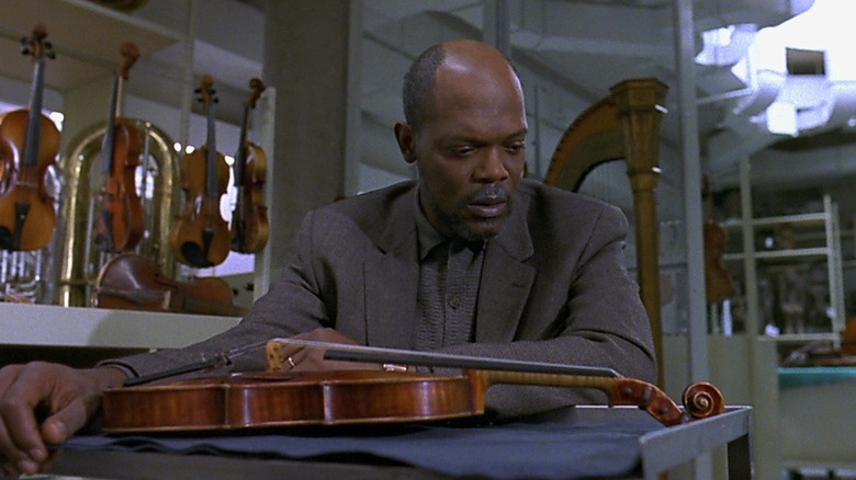 Samuel L Jackson looking down at violin