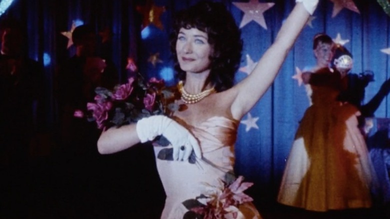 Lisa Schrage smiles and waves 