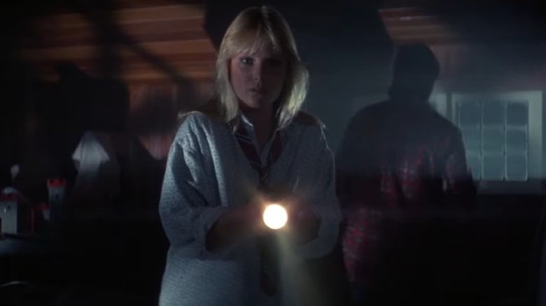 Amy Steel holding a flashlight in "April Fool's Day"