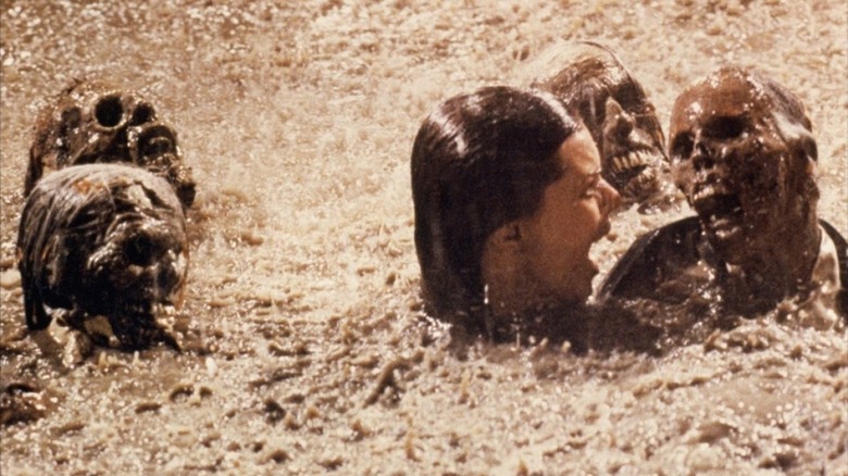 Diane Freeling, swimming during a rainy night, being visited by skeltal corpses. She screams. A scene from Poltergeist.