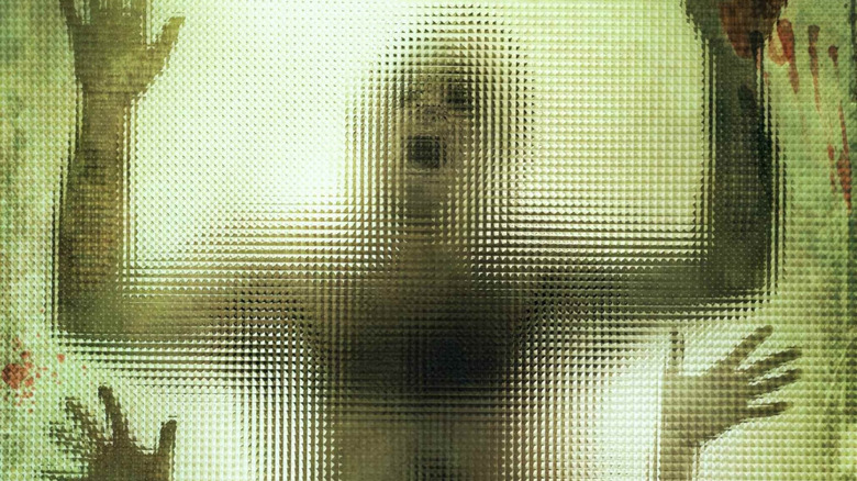 The three subjects sewn together on the poster for The Human Centipede (First Sequence)
