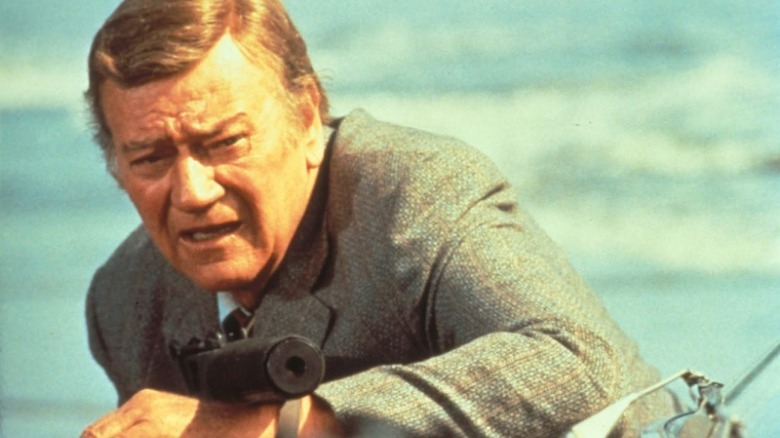 John Wayne throws punch McQ