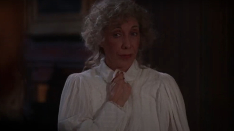 Lyda frowning