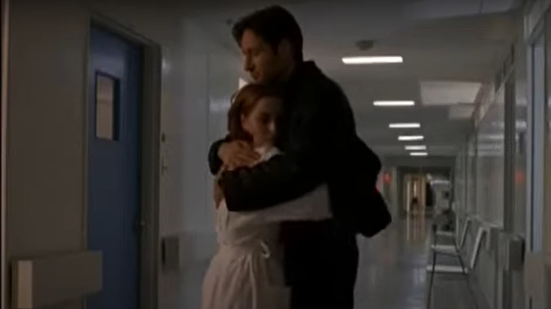 Agents Mulder and Scully hugging