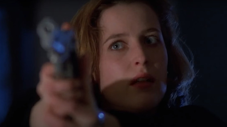 Agent Scully aiming gun