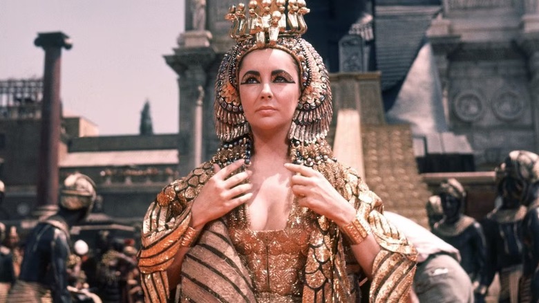 Elizabeth Taylor, as Cleopatra, models the infamous and glorious golden Isis robe in 1963's Cleopatra