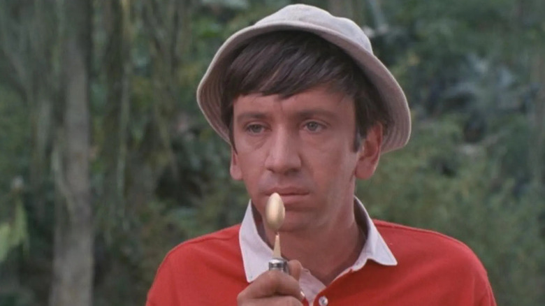 Gilligan holding a spoon up to his mouth in Gilligan's Island