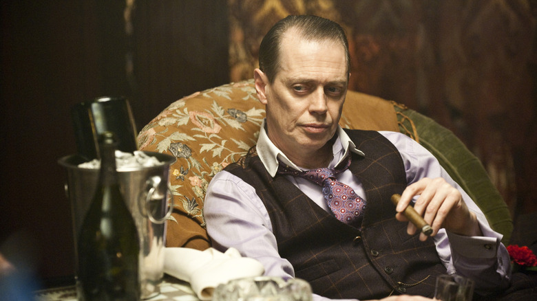 Nucky Thompson smoking a cigar in Boardwalk Empire