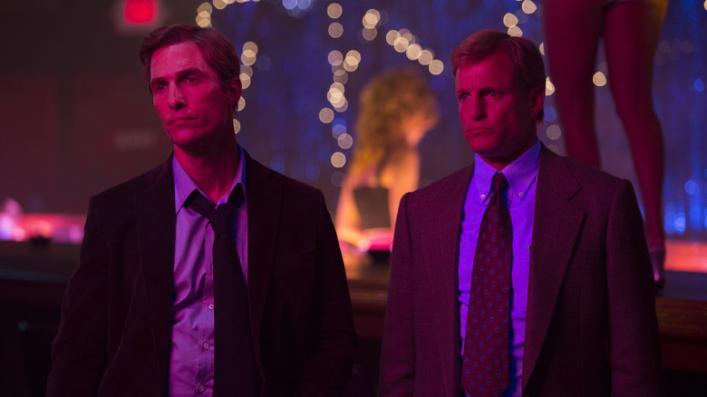 Rust Cohle and Martin Hart under bisexual lighting in True Detective season 1