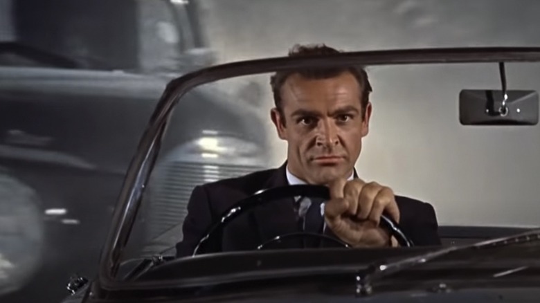 Sean Connery is in the midst of a harrowing car chase as James Bond in Dr. No