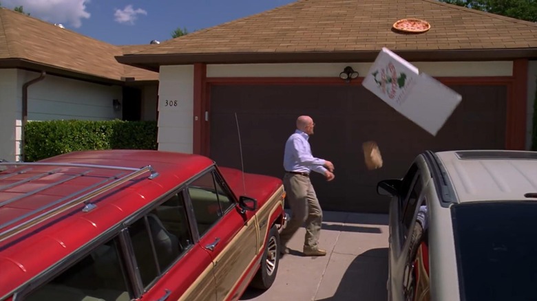 Walt throws a full pizza on the roof of his house in Breaking Bad