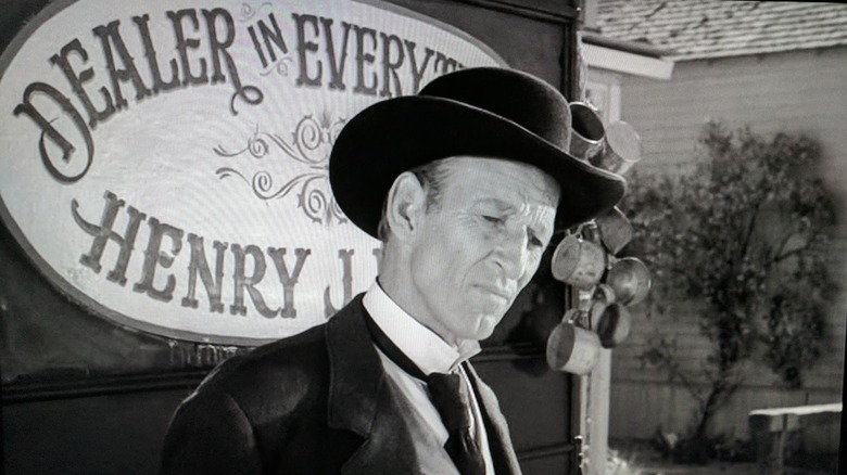 Henry J. Fate standing in front of his cart in The Twilight Zone's "Mr. Denton on Doomsday"