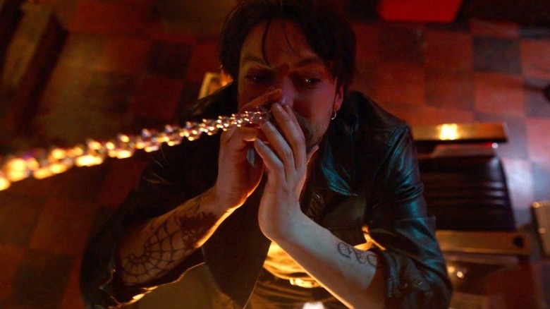 Richard Harmon as Erik having his nose ring pulled on by a chain in Final Destination Bloodlines