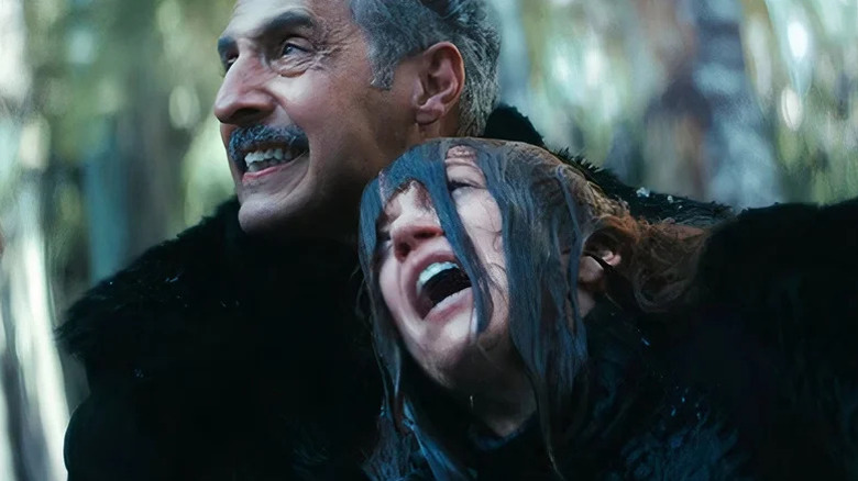 John Turturro's Irving B. holding Britt Lower's Helena Eagan by the neck on Severance