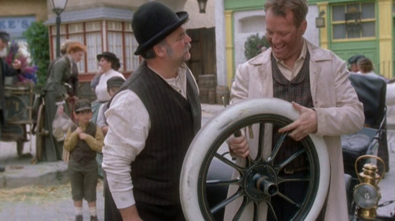 A kindly man in a hat and Tom Paris, both in a 19th century setting on Star Trek: Voyager