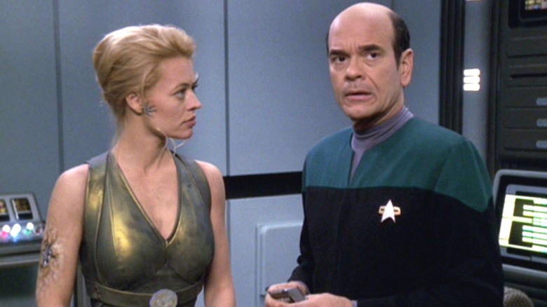Seven of Nine in a tank top and the Doctor on Star Trek: Voyager