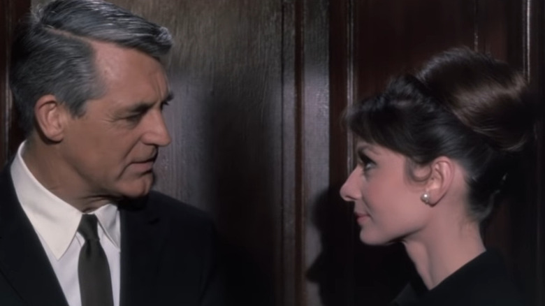 Grant looks at Hepburn