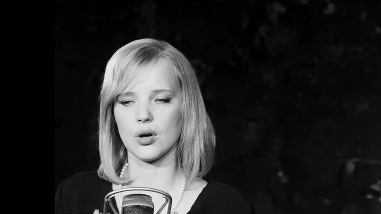 Kulig sings into microphone