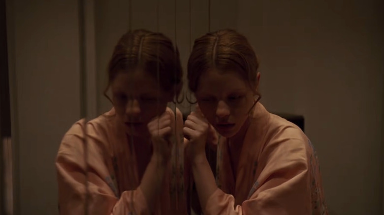 Mia Goth in reflection