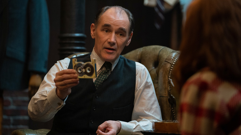 Rylance holding tape