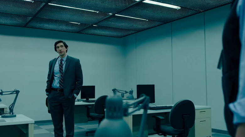 Driver stands in underground office