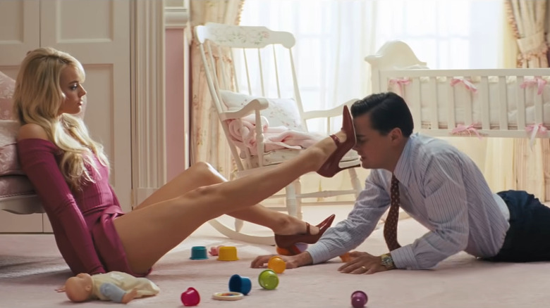 Leonardo DiCaprio on floor with Margot Robbie