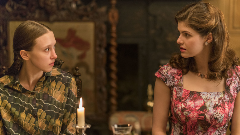 Farmiga and Daddario staring at each other