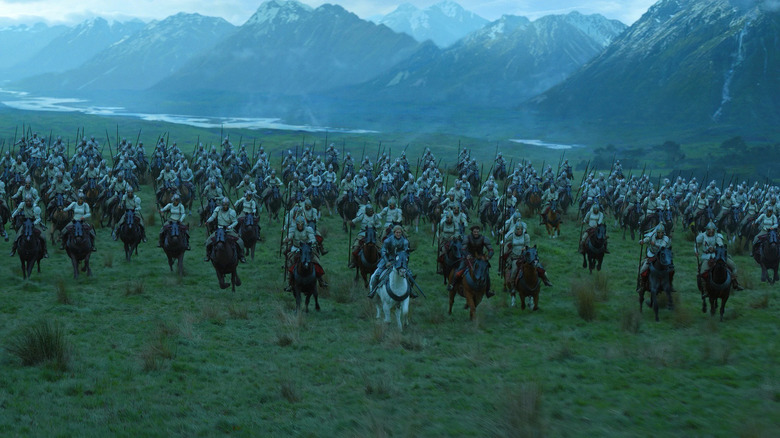 soldiers riding horses mountains