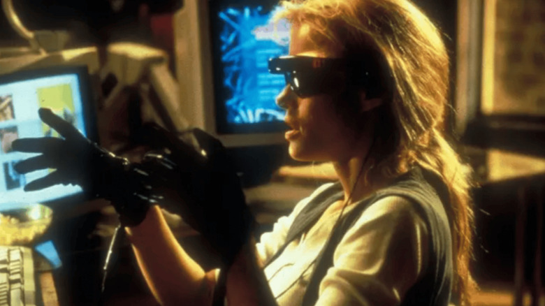 Sydney Bloom wearing VR goggles and gloves on VR.5