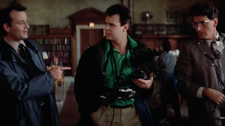 Murray, Aykroyd, and Ramis in library