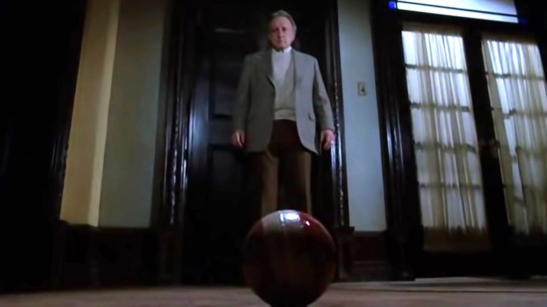 George C. Scott looks at ball in The Changeling