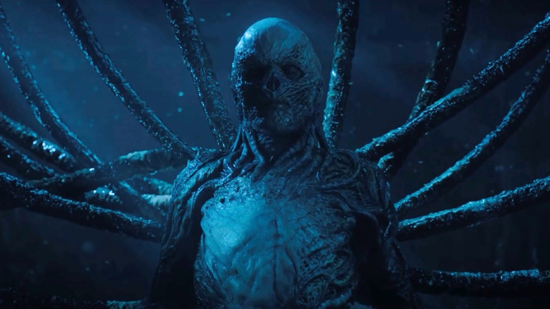 Jamie Campbell Bower as Vecna with tendrils emerging from his back on Stranger Things