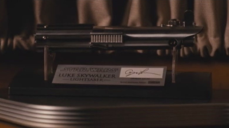 Christian Wolff's lightsaber collectible in The Accountant