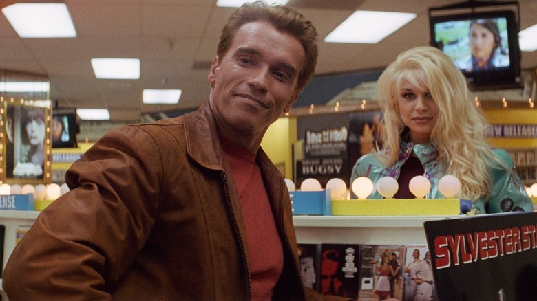 Arnold Schwarzenegger as Jack Slater inspects the video store in Last Action Hero
