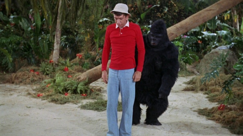 Gilligan being trailed by a gorilla in an episode of Gilligan's Island.