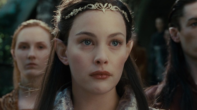 Arwen watching Aragorn leave with misty eyes in The Lord of the Rings: The Fellowship of the Ring
