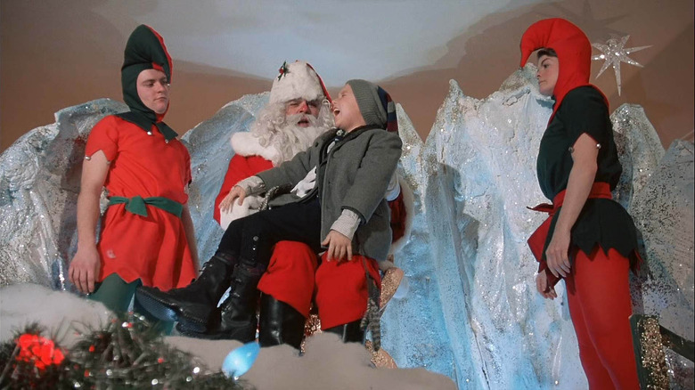 Ian Petrella as Randy Parker with Santa Claus in A Christmas Story