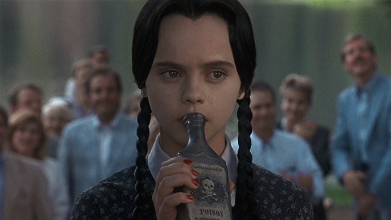 Wednesday Addams drinking poison